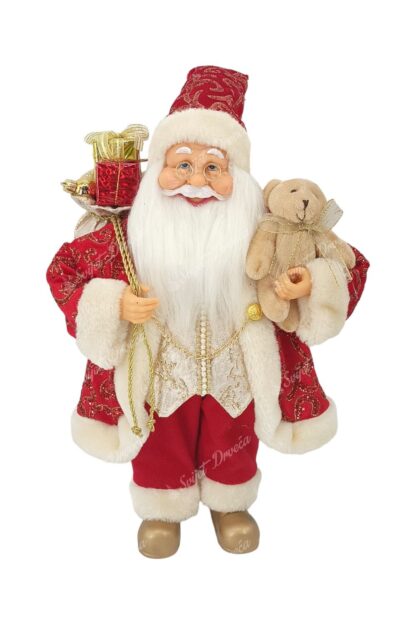 Dekoracija Santa Claus crveno-zlatni 40cm, ima crveni kaputić sa bijelim krznom, u jednoj ruci nosi igračku mjedvedića a u drugoj vrećicu sa poklonima
